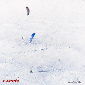 snowkiters exploring landscape pallas